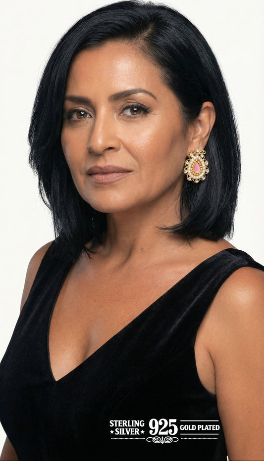 Woman wearing paisley shaped earrings.