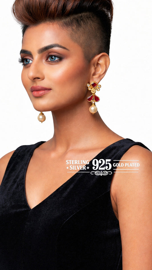 Woman wearing gold-plated earrings.